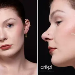 Kobieta z septum i nostril. Złote kolczyki podkreślają jej urodę.